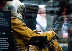 an astronaut in a room full of equipment