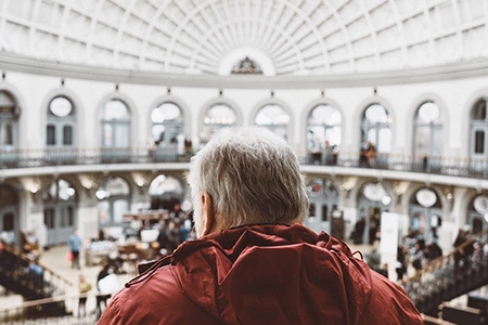 old man overseeing a museum